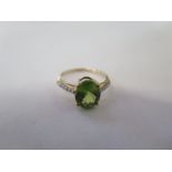 A 9ct yellow gold peridot set ring - size N - approx 2.4 grams - in good condition