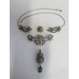 A 19th Century silver gilt old cut diamond and peridot five piece interchangeable necklace,
