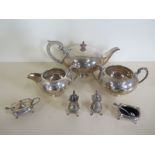 A silver four piece cruet set and a plated three piece tea set, silver weight approx 4.6 troy oz