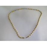 An 18ct yellow gold and white metal necklace set with small diamonds - 44cm long - approx 30 grams -