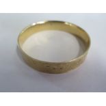 A gold bracelet engraved with decorative cherub, swan and foliate forms, approximately 19.1g,