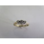 A 9ct yellow gold three stone diamond ring - size M - approx 2.2 grams - some usage but generally