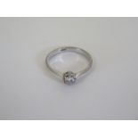 A diamond solitaire ring with 18ct gold band, ring size N, approximately 2.6g, inclusion to diamond