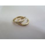 A pair of 14ct gold diamond earrings, each set with nine stones, approx 4 grams - good condition