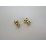 A pair of diamond and 18ct gold earrings.