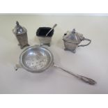 A silver strainer and a silver cruet set, total silver weight approx 4 troy oz