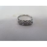 A platinum four stone diamond ring - brilliant cut diamonds, total approx 1.05ct - ring size N -