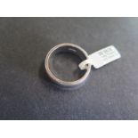 A hallmarked 9ct white gold band ring - size P/Q, approx 6.5 grams - some usage marks, otherwise