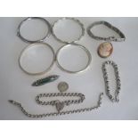 A collection of silver jewellery, including four bangles, and some bracelets, approximately 7toz,