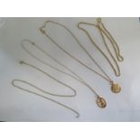 An 18ct yellow gold chain - 52cm long - approx 3.2 grams - and three 9ct chains, and two pendants,