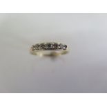 A 9ct yellow gold seven stone diamond ring - approx 0.33ct total - ring size N - approx 1.4