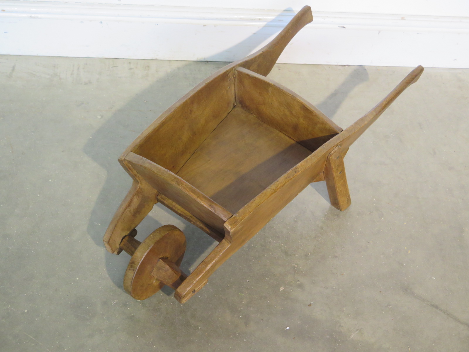 An ornamental wooden wheelbarrow suitable for use as a planter 76cm long - in good restored and - Image 2 of 2