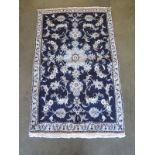 A blue ground nain rug, approximately 144 cm x 88 cm, in good condition