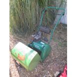 A Qualcast petrol 14 S cylinder mower with associated grass box, from a deceased estate so not