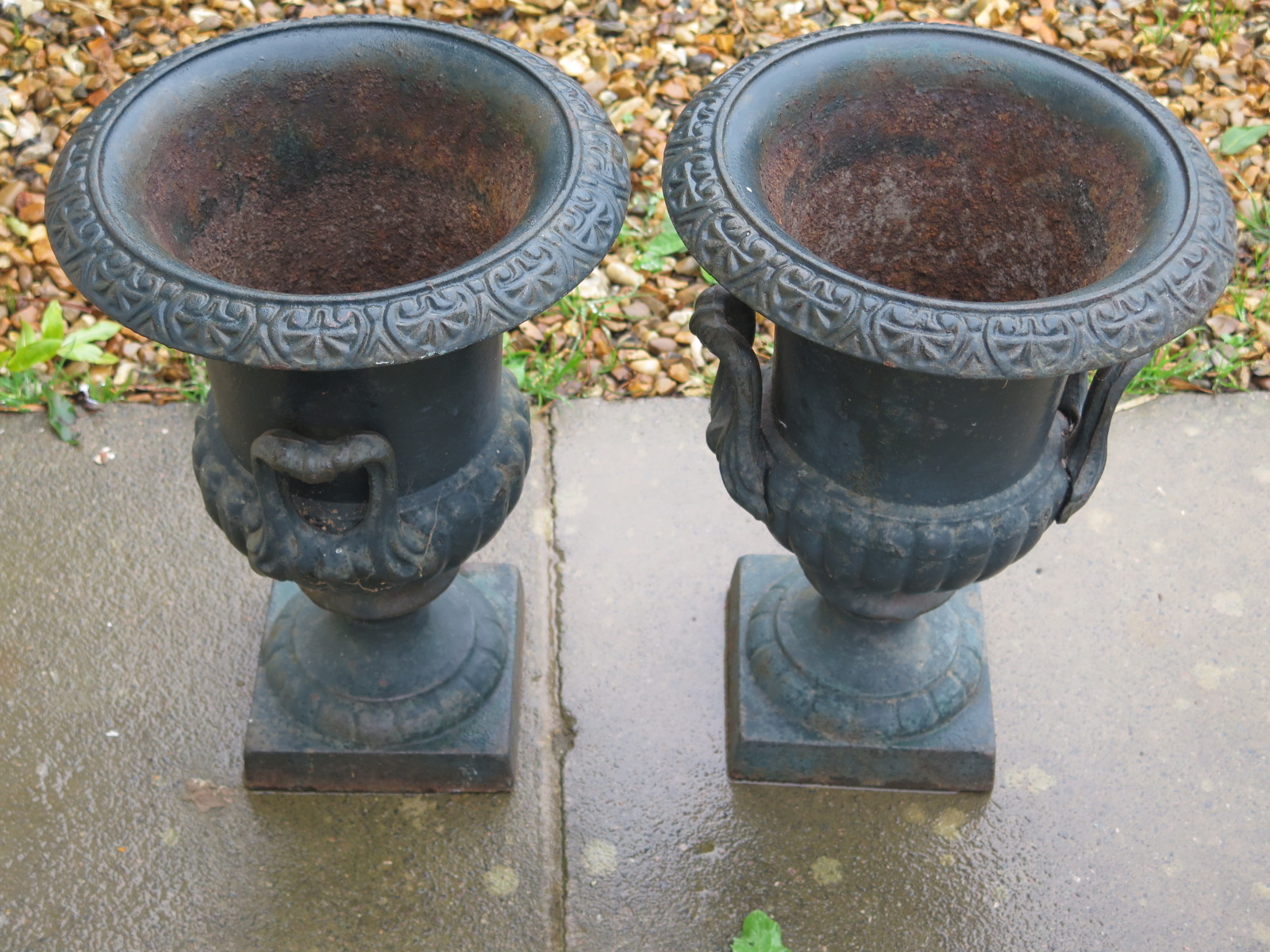 A pair of cast iron garden planters, approx 43cm H