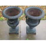 A pair of cast iron garden planters, approx 43cm H