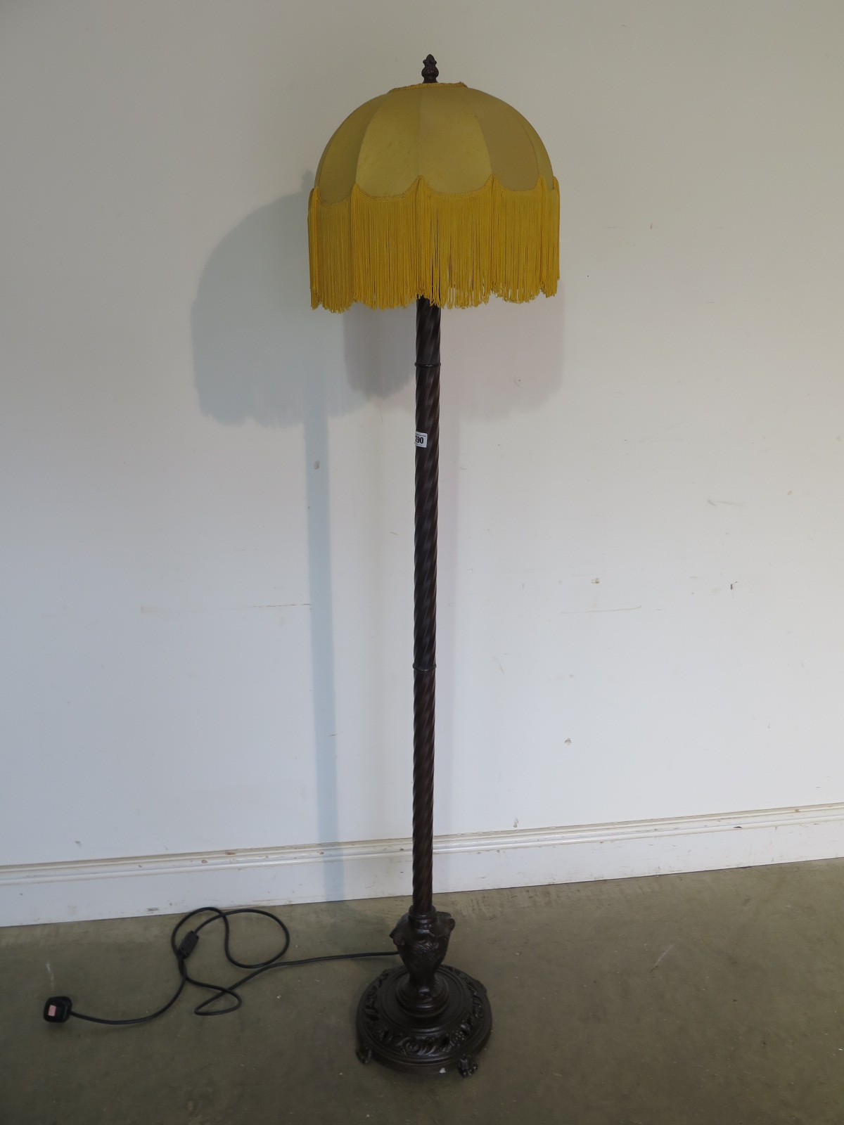 A very unusual 1920s standard lamp and shade, bronzed metal column finishing in a cast iron base