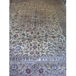 A large caucasian ground kashan rug, approximately 400cm x 292cm