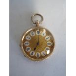 A 14ct yellow gold pocket watch with base metal dust cover - 4cm diameter, running in saleroom,