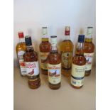 Seven bottles of Scotch whisky, two 1 litre bottles of Famous Grouse, a William Grant 1 litre