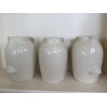 Two Doulton stoneware acid jugs and a similar jug, 38cm tall, all have minor chips