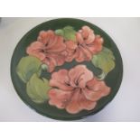 A Moorcroft green ground plate - 26cm diameter