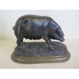 A bronze figure of a pig, 17cm tall, 24cm wide, good condition