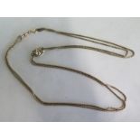 A gilt metal chain with a 9ct watch chain link and gilt metal loop, total weight approx 27 grams