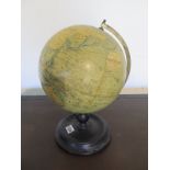 A vintage Phillips 9 inch Terrestrial Globe with ebonised stand, approximately 34cm high overall,