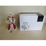 A Royal Doulton figurine of Father Christmas, approximately 22.5cm high, with original box