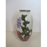 A Cobridge floral decorated vase - 21cm tall - good condition, boxed