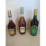 Three bottles of cognac and brand, Martell VS, Reyna Pineau des Carentes and a bottle of Napoleon