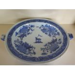 A large Chinese 18th Century armorial blue and white porcelain warming dish decorated with a crest