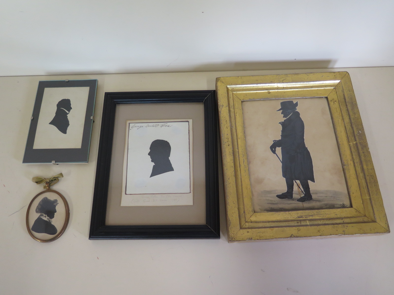 A collection of four silhouettes, largest in a gilt frame, 26cm x 22cm - of Dr Burns Peterhouse