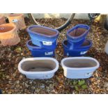 Four blue troughs - width 32cm