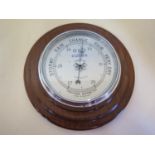 A mahogany case aneroid barometer 6 inch silvered dial, chrome bezel