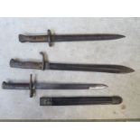 A Waffenfabrik Mauser bayonet - 59cm long, a bayonet and scabbard number VW9943 and a Wilkinson