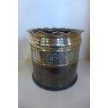 A WW1, 1917 trench art German shell case planter with impressed floral pattern, approximately 23cm