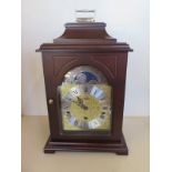 A Franz Hermle German three train mantle clock chiming on rods with moon roller, 36cm tall, 23cm