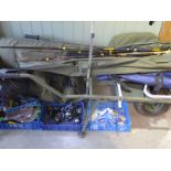 A collection of fishing gear to include a Carp-Porter trolley, a Preston Roller, a short pole,