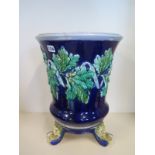 A majolica vase in a stand, 45cm H x 34cm - the vase part has been damaged and repaired, please