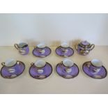 A set of six Noritake landscape decorated coffee cans and saucers with sugar bowl and milk jug, some