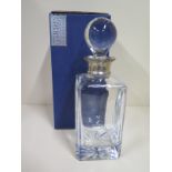 A Carrs contemporary collection, silver collared, cut glass decanter with original box, some light