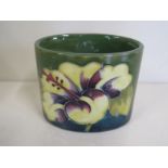 A Moorcroft Hibiscus pattern, oval small vase, 6cm tall, in good condition, some scratches