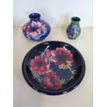 Three pieces of Moorcroft with Anemone pattern designs, a plate 22cm diameter, a vase 10cm high both