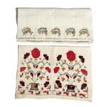 Two 19th century Ottoman embroidered linen hand towels, one worked with metal thread with urns of