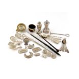 λ A mixed lot of old Sheffield plated items, comprising: two sugar crushers, a pepper pot, five