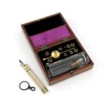 A Sikes pocket hydrometer, in a fitted wooden case, the hinged cover inlaid with an inscribed