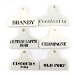 A collection of six 19th century ceramic bin labels, some by Copeland, arched rounded rectangular