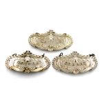 A set of three electroplated wine labels, shaped oval form, with lion pelt decoration, gadroon